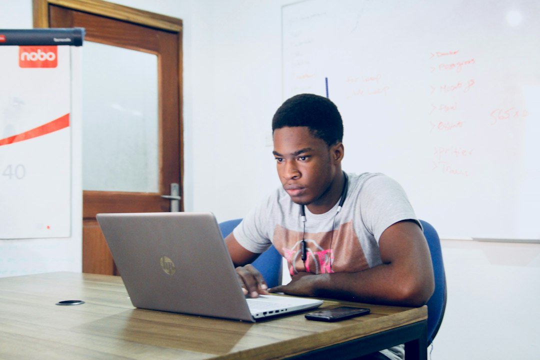 Student learning AI tools on a laptop