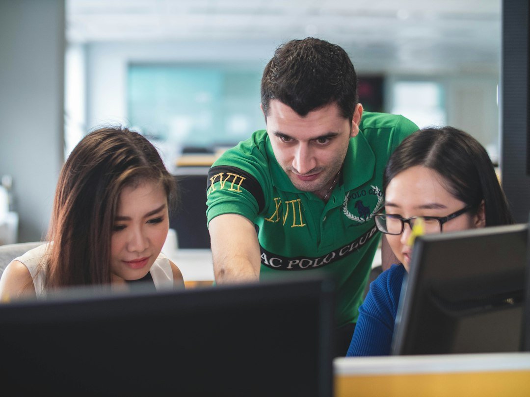 People learning computer skills together on a computer screen