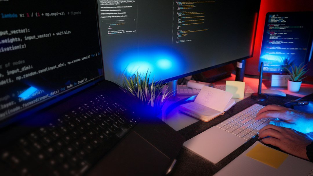 Programmer working on a website at a multi-screen desk
